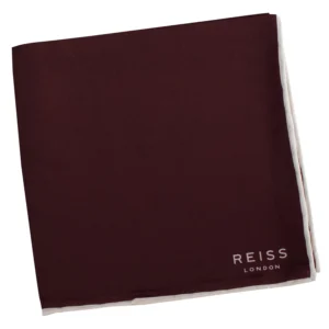 Pochette REISS bordeaux pliée, avec liseré blanc et logo visible.