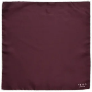 Pochette REISS bordeaux vue à plat avec contours blancs.