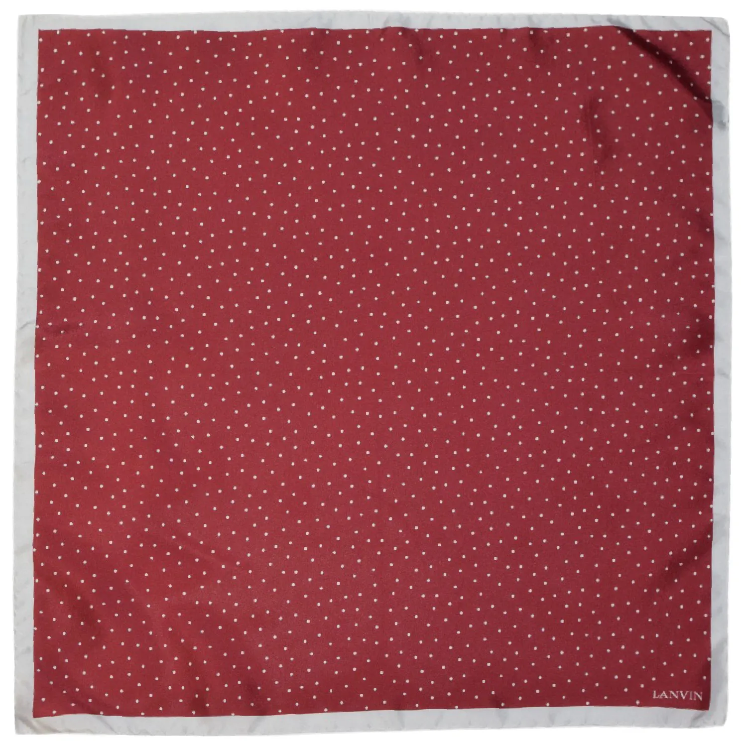 Pochette Lanvin rouge fraise à pois blancs avec liseré blanc, vue à plat.